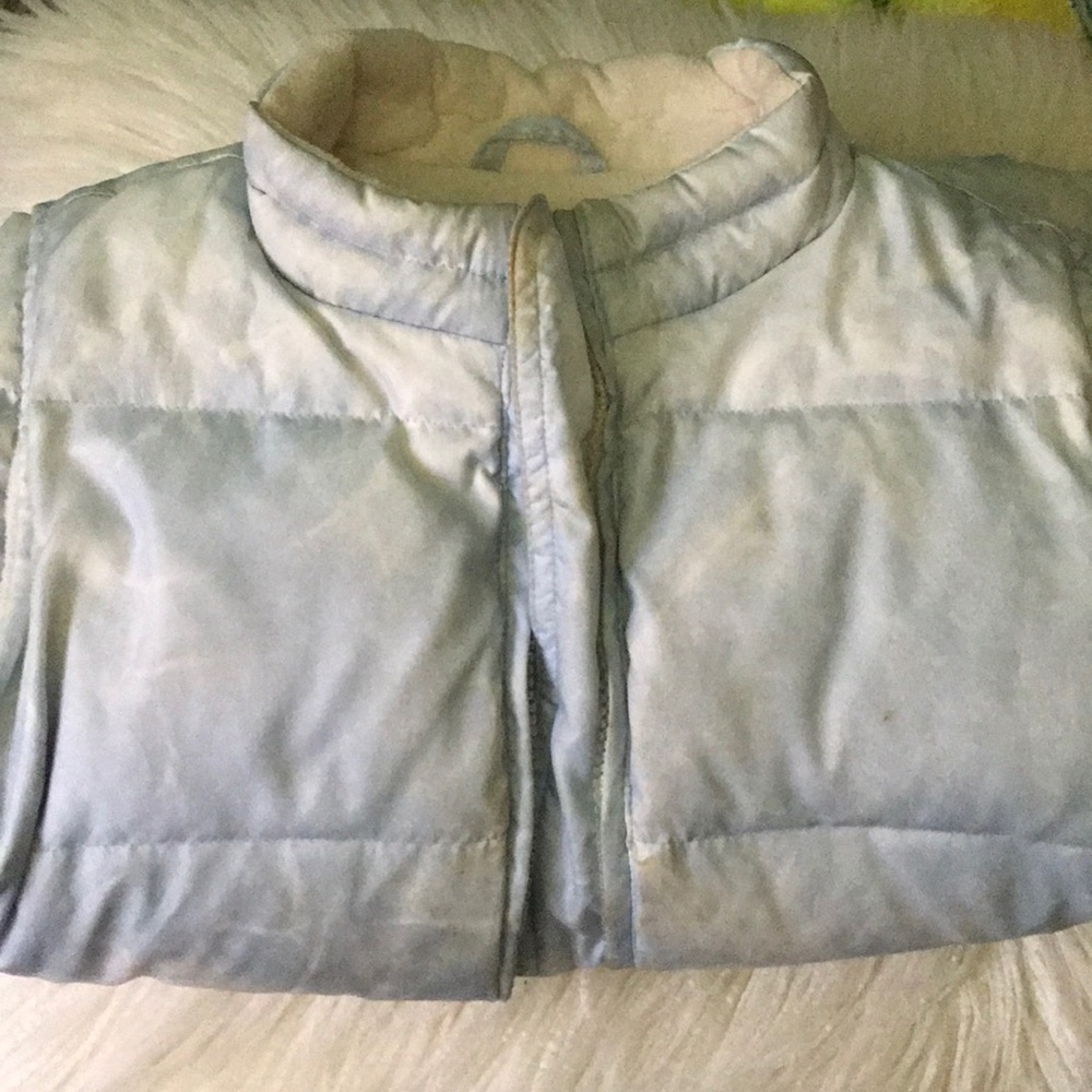 a light blue vest
